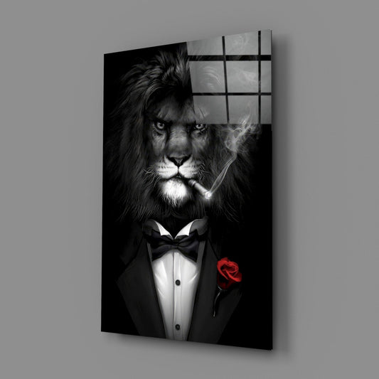 Lion in tuxedo glass wall art on a gray wall, light reflecting off the glossy front