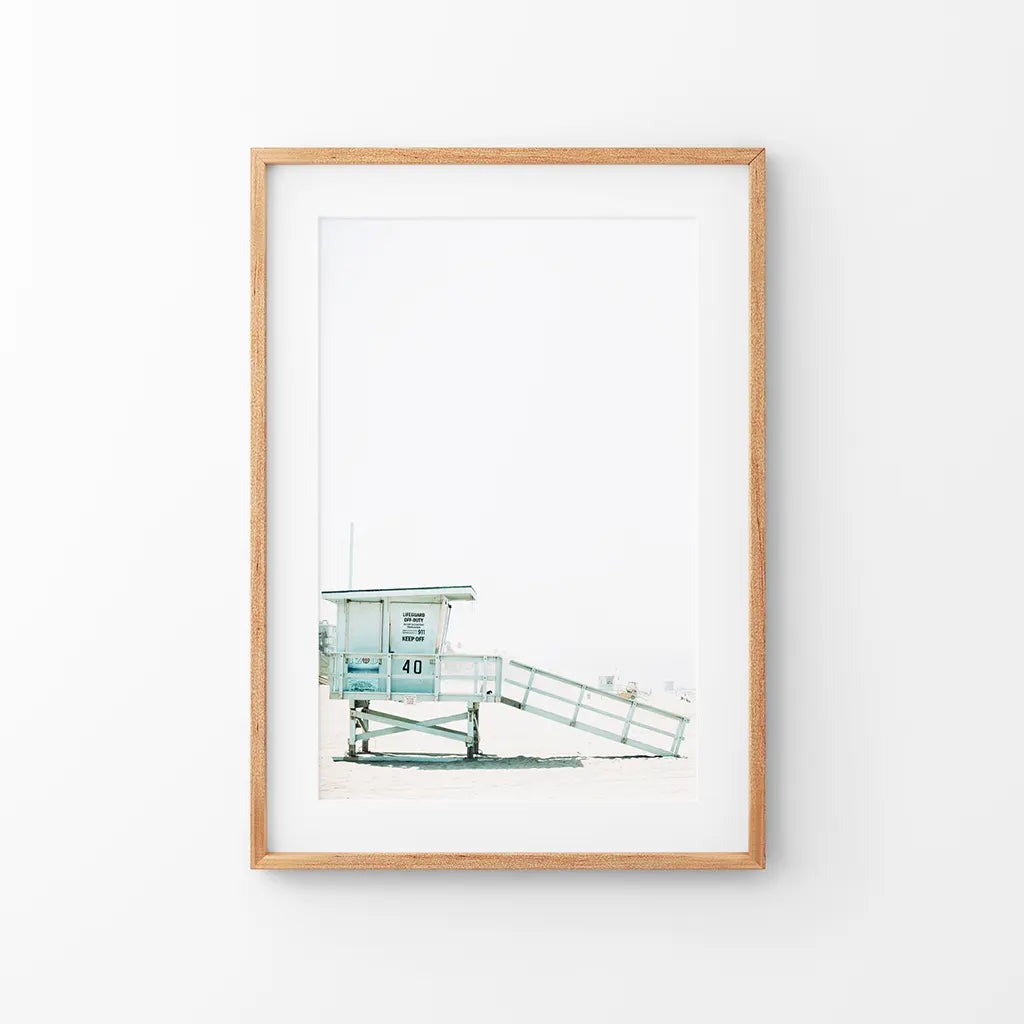 California coastal wall art print of a blue lifeguard tower by the ocean
