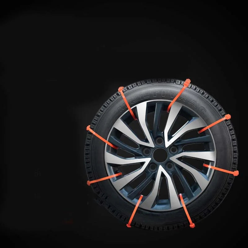 Car tire fitted with multiple anti skid traction ties against dark background