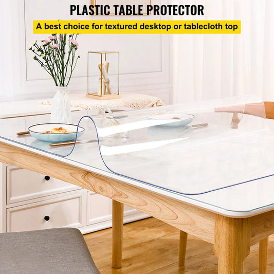 Clear plastic table cover on wooden dining table protecting surface from spills