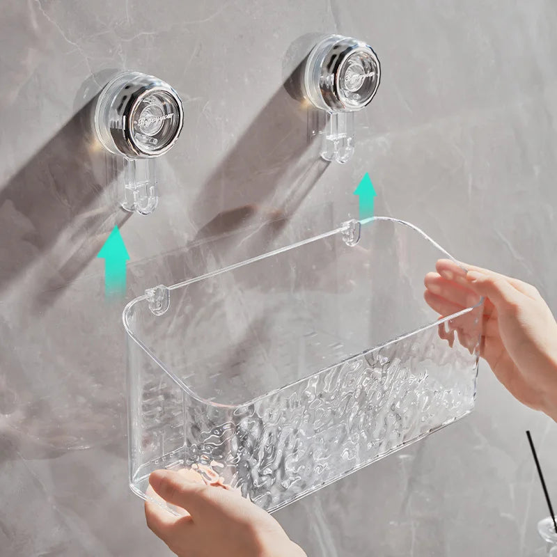 Clear shower caddy with suction cups attached to a glass surface.