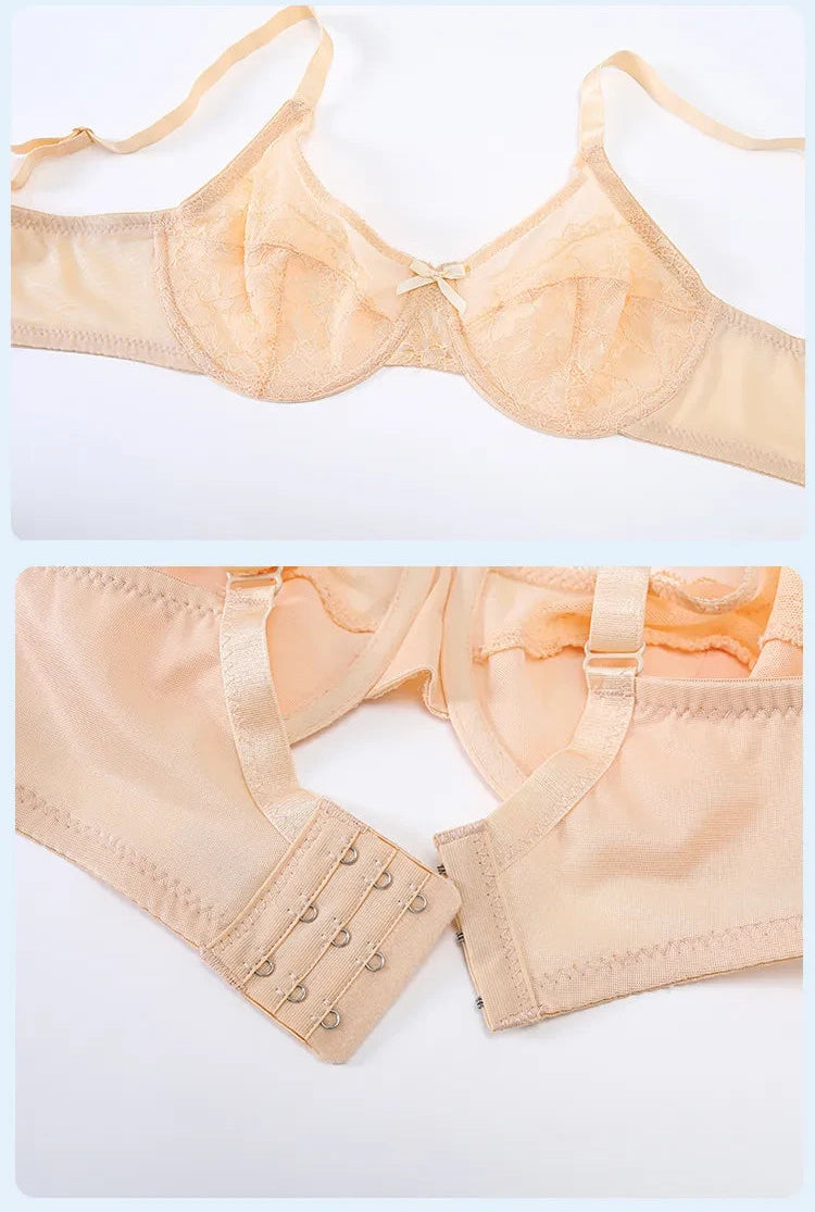 Close-up beige minimizer bra lace detail hook-and-eye closure with multiple adjustment positions shown