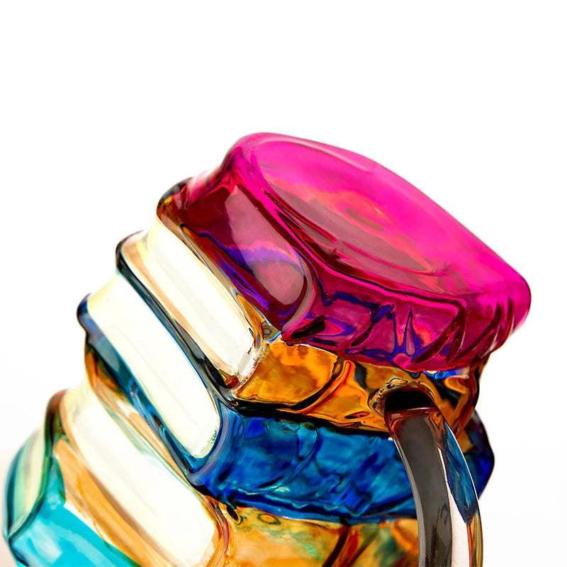 Close-up of pink and orange book-style glass mug base highlighting vibrant colors