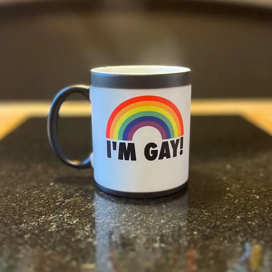 Color-changing mug fully activated showing rainbow and “I’M GAY!” text