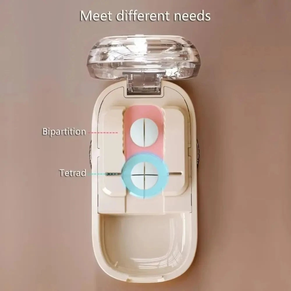 Compact pill cutter showing built-in storage compartment with divided pills inside