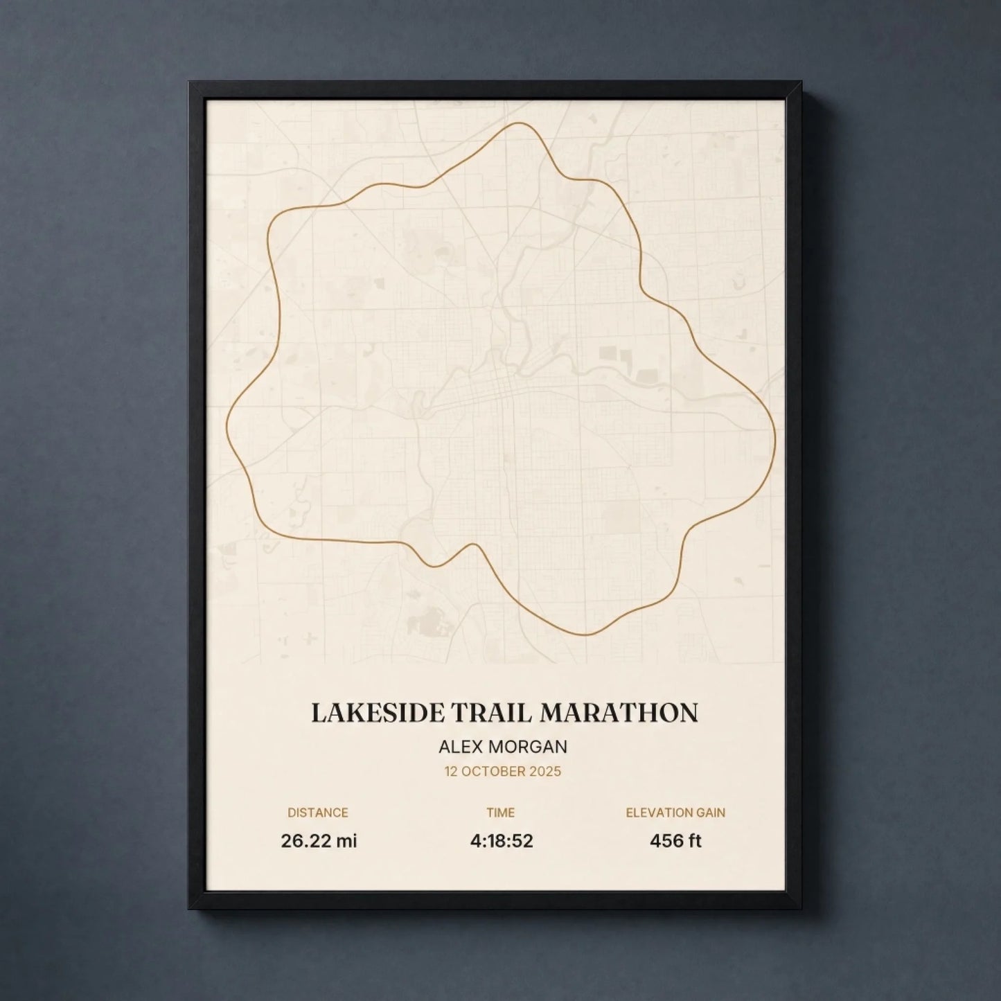 Custom marathon map print of a race route, framed in black wood and hung on a wall