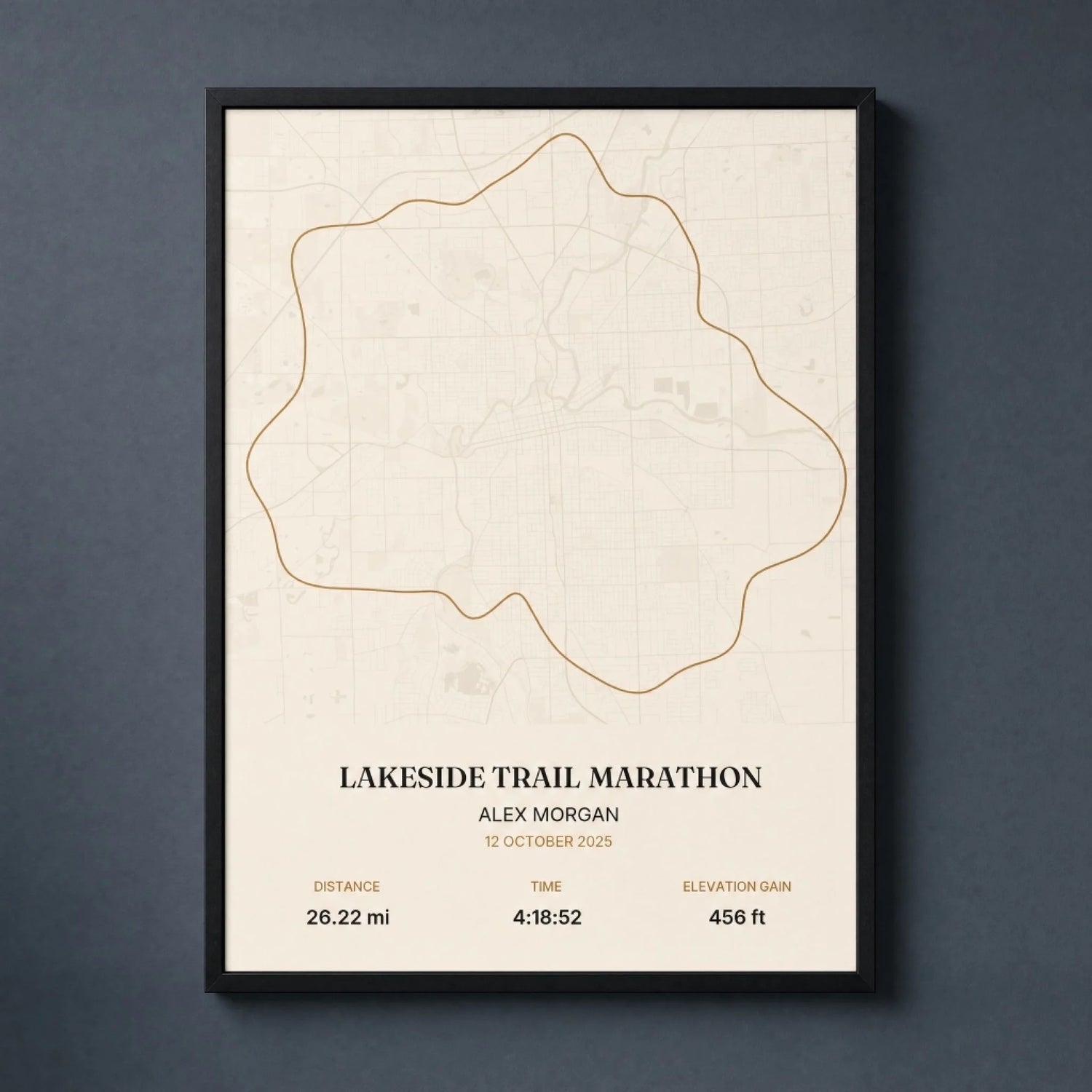 Custom marathon map print of a race route, framed in black wood and hung on a wall