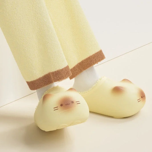 Cute cat paw slippers worn indoors with cozy home outfit