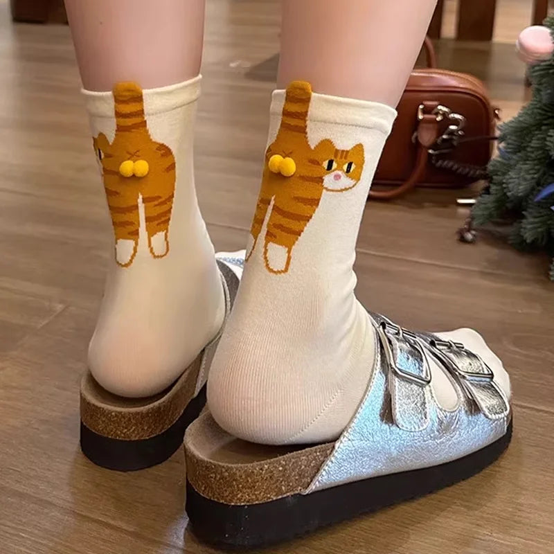 Cute cat socks with orange tabby and 3D pom-pom tail on legs