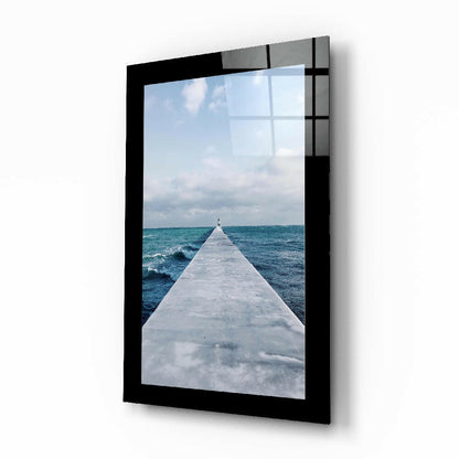 Far Horizon glass wall art with coastal pier and distant lighthouse
