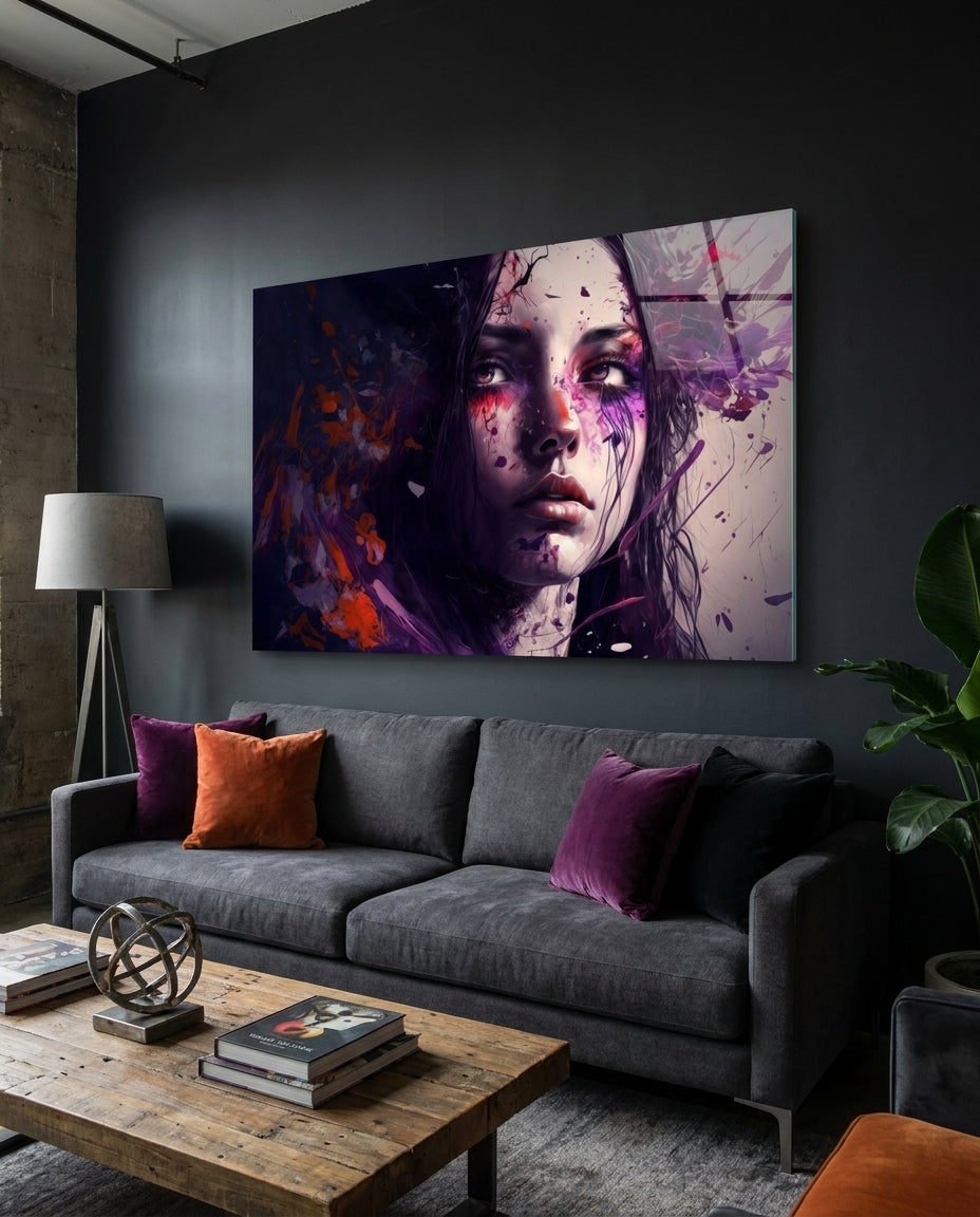 Melancholy woman with purple splatter glass wall art above a gray sofa with purple cushions in a dark living room