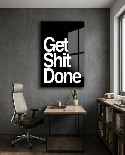 Get Sh*t Done bold white on black glass wall art in a home office above a desk and mesh chair
