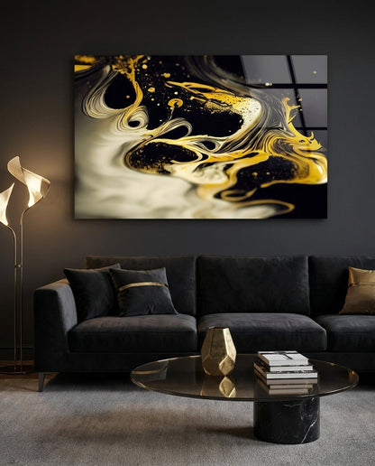 Black and gold fluid swirl glass wall art above a black velvet sofa with gold cushions and a round glass coffee table