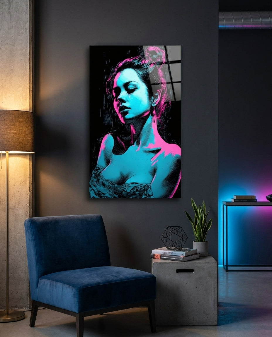 Neon cyan and pink woman portrait glass wall art in a dark room beside a blue armchair and concrete side table