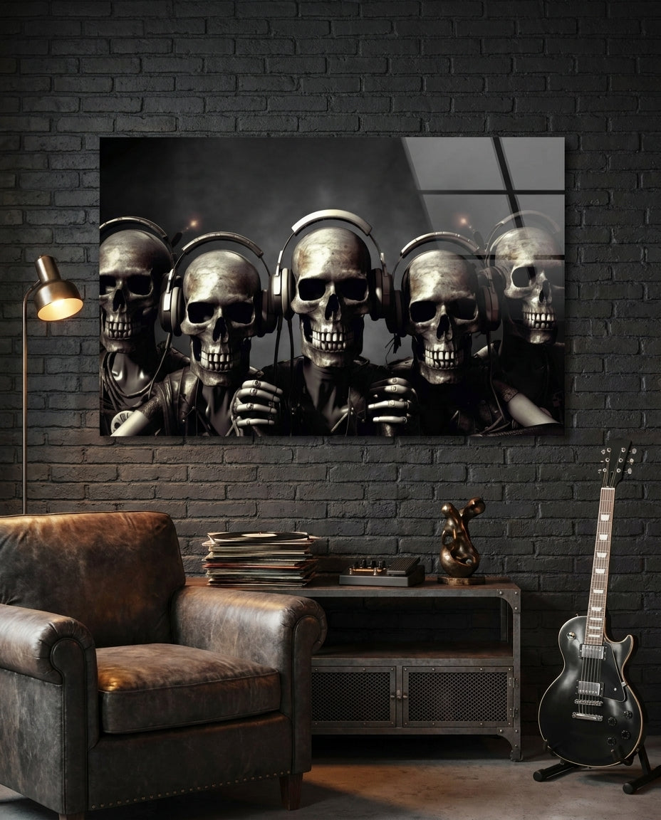 Five skulls in headphones glass wall art on a black brick wall above a leather armchair and an electric guitar