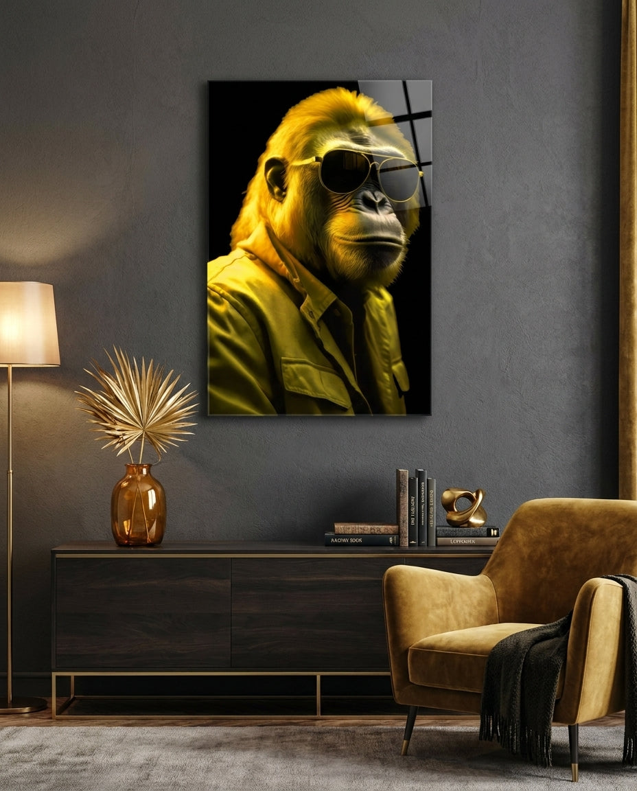 Yellow gorilla in aviator sunglasses glass wall art above a dark sideboard beside a mustard armchair and floor lamp