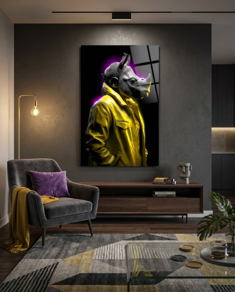 Rhino in yellow jacket glass wall art on a dark gray wall above a wooden console beside a gray armchair