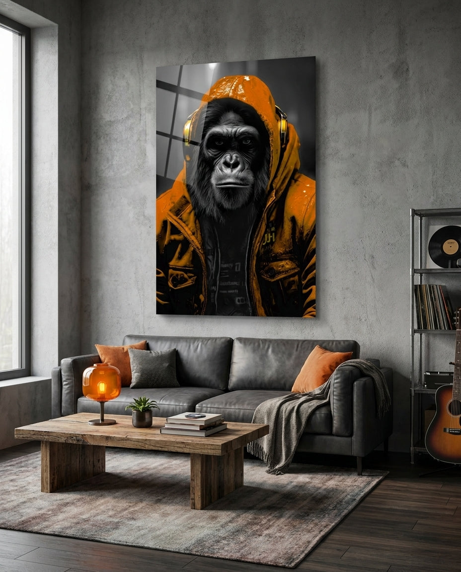 Orange rain hood gorilla glass wall art above a gray sofa and wooden coffee table