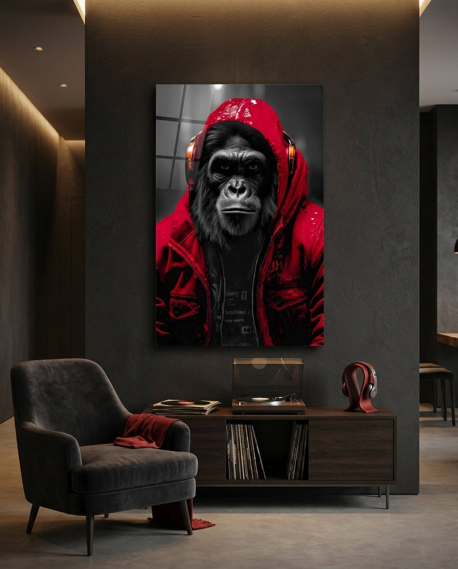 Red rain hood gorilla glass wall art above a low console with records beside a dark gray armchair