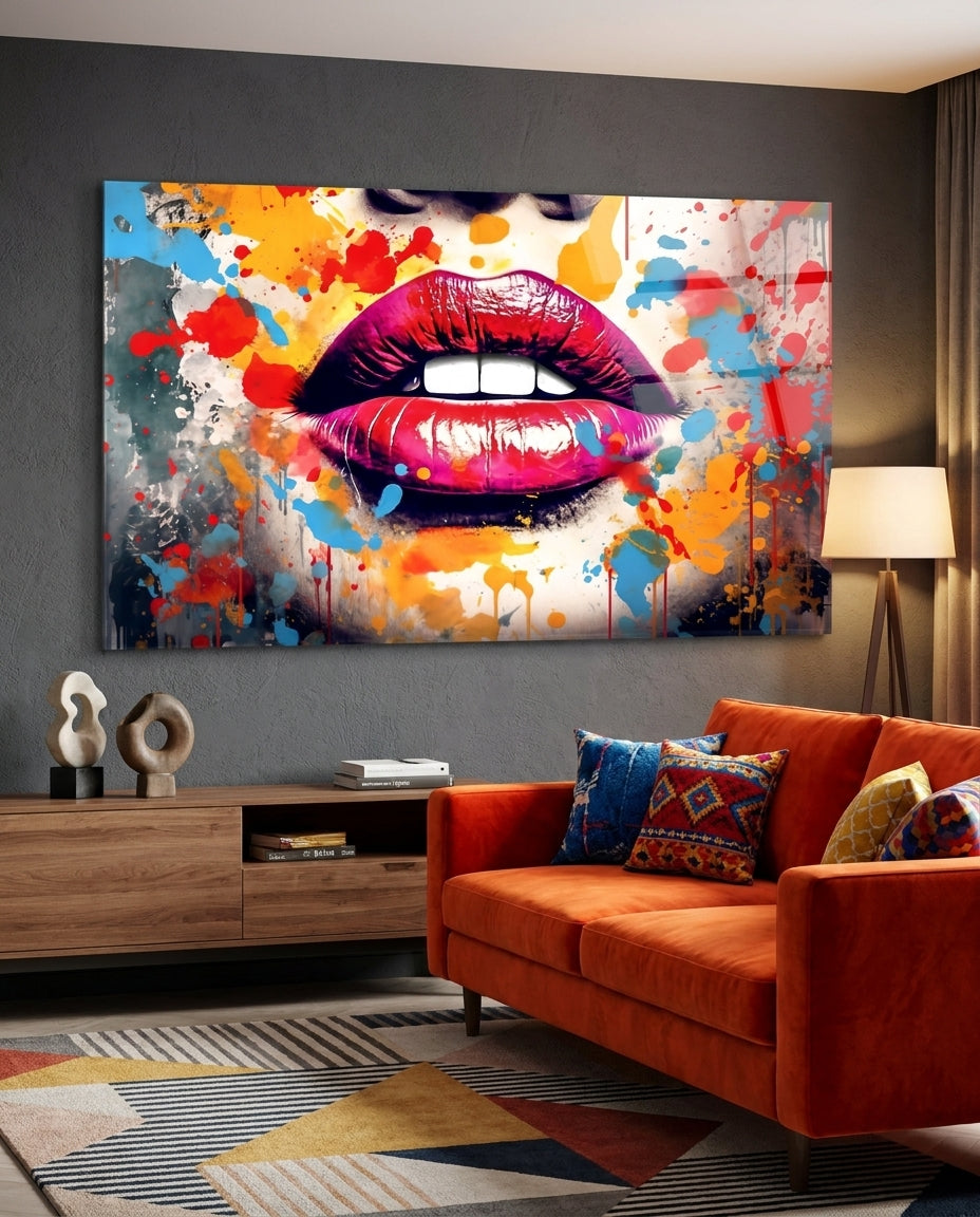 Pink pop art lips glass wall art above an orange velvet sofa and a wooden console