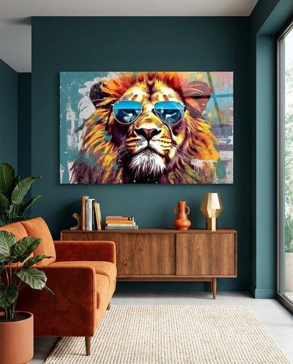 Lion in blue aviator sunglasses glass wall art on a dark teal wall above a wooden sideboard and rust armchair