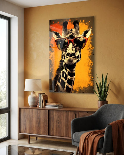 Giraffe in red sunglasses glass wall art on a warm brown wall above a wooden sideboard and gray armchair