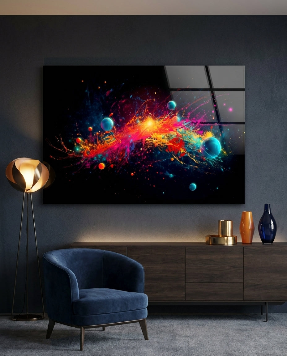 Cosmic paint burst with planets glass wall art on a dark wall above a wooden sideboard beside a navy armchair