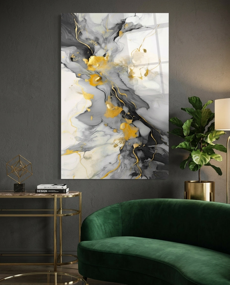 Charcoal and gold marble glass wall art above a curved green velvet sofa on a dark wall