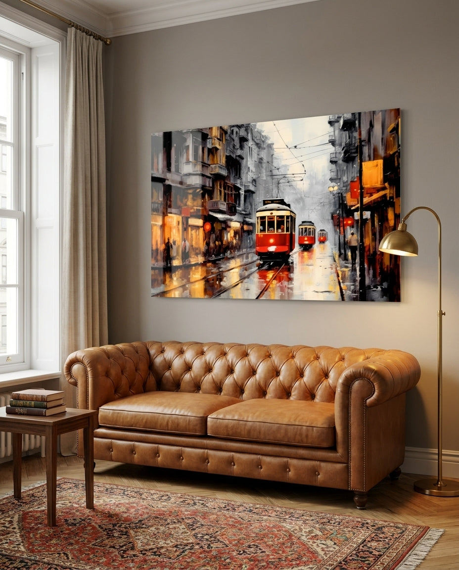 Red tram on a rainy street glass wall art above a tan leather sofa and patterned rug