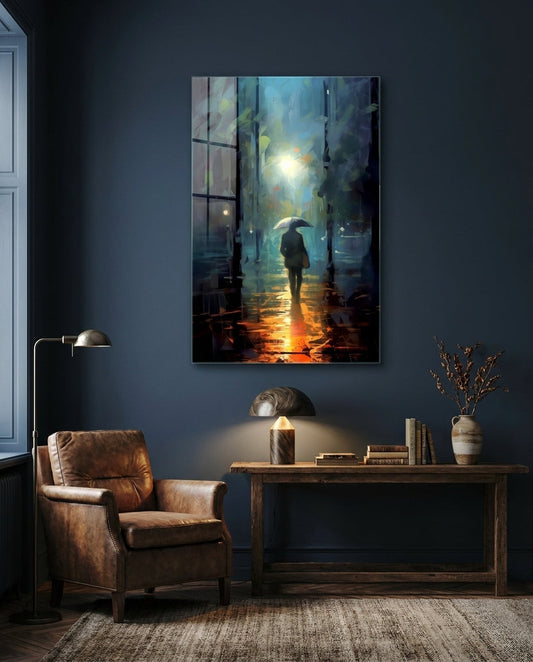 Rainy night alley glass wall art above a wooden desk and leather armchair on a navy wall