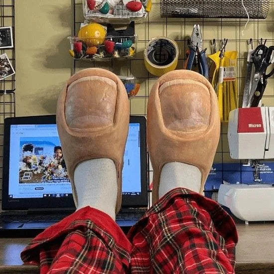 Damuge big toe slippers worn with plaid pajama pants – funny cozy winter house slippers