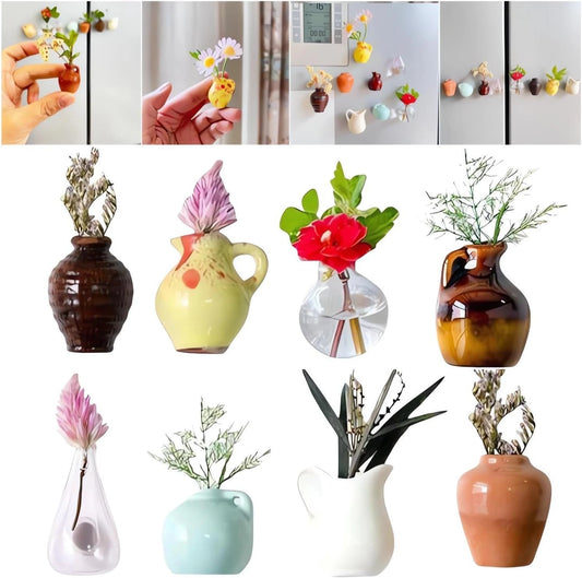 Eight colorful mini ceramic vase magnets arranged on white wall with small flowers
