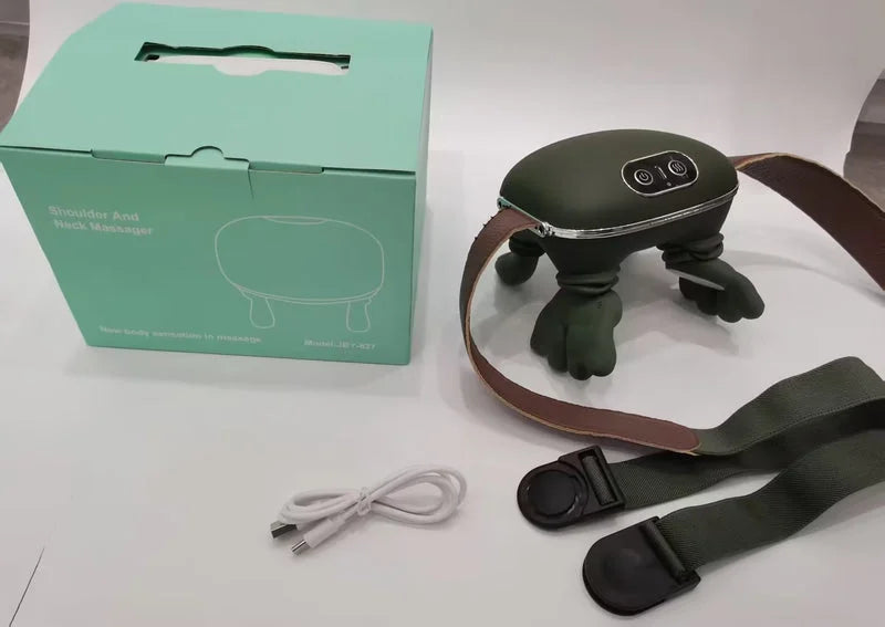 Electric neck and shoulder massager set with box, charging cable, and adjustable strap placed on a table.
