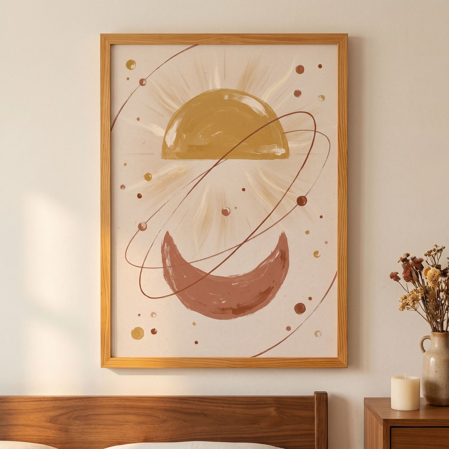 Framed abstract art with celestial design on a wall above a bed.