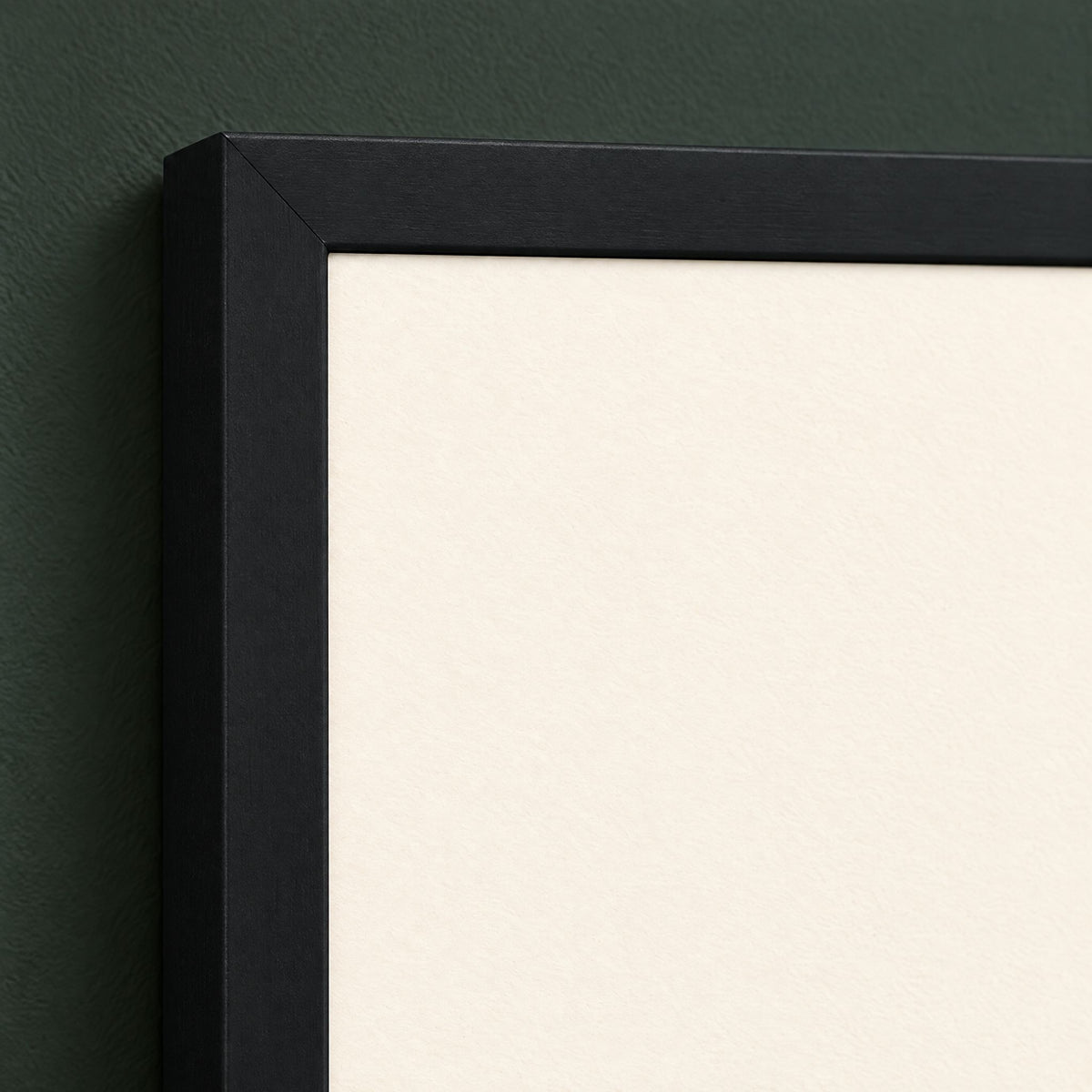 Frame corner close-up showing the mitred black wood moulding and the print edge, no mat