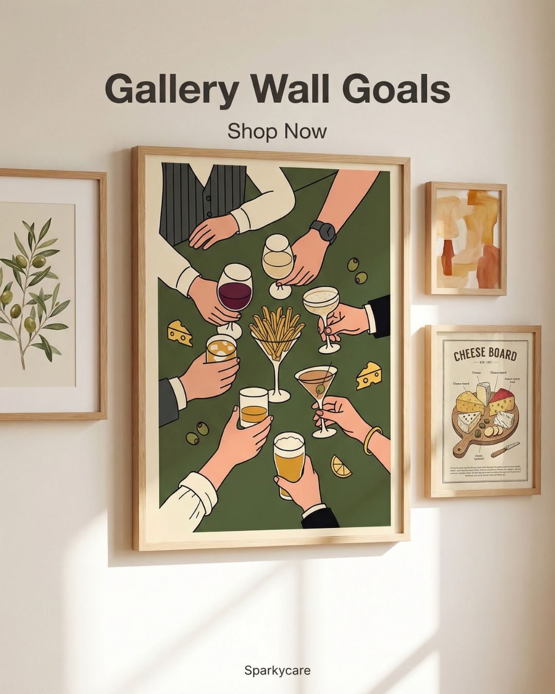 Framed artwork of hands holding drinks on a wall with other framed pictures.