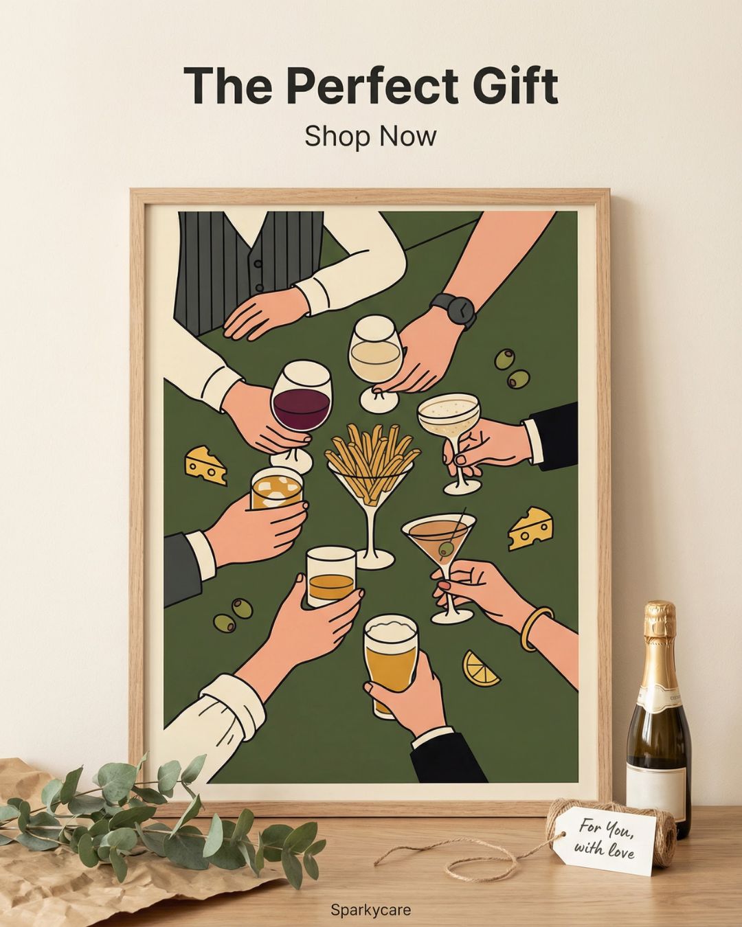 Framed artwork of hands holding drinks with a bottle of champagne on a wooden surface.