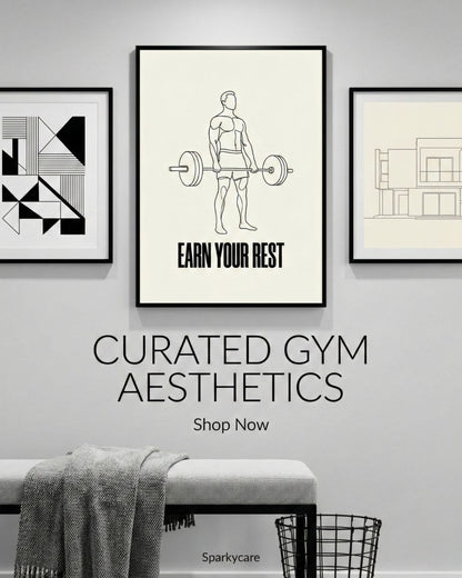 Framed artwork on a wall with text 'Earn Your Rest' and 'Curated Gym Aesthetics' by Sparkycare.