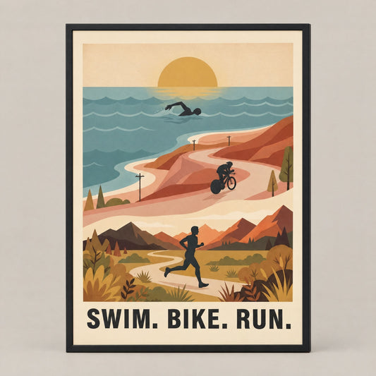Framed retro triathlon wall art print, solid pine frame, swim bike run sunrise scene, shown against a plain studio ground