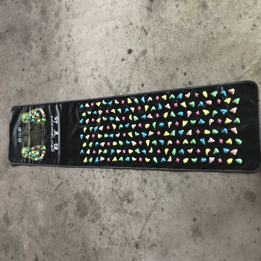 Full length reflexology foot massage mat with colorful textured stones for acupressure therapy