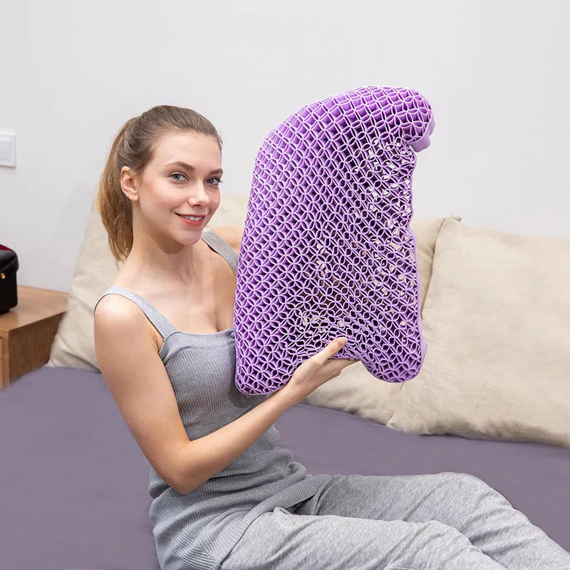 Gel cold pillow shown held upright demonstrating flexible honeycomb structure in purple
