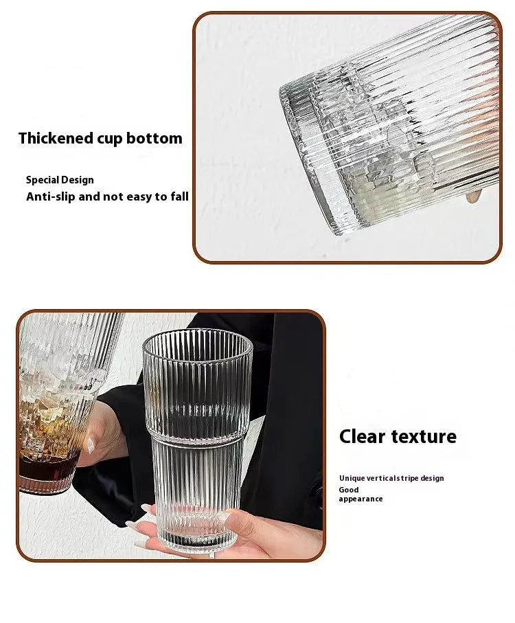 Glass cup with textured design and thickened bottom, held by a person.