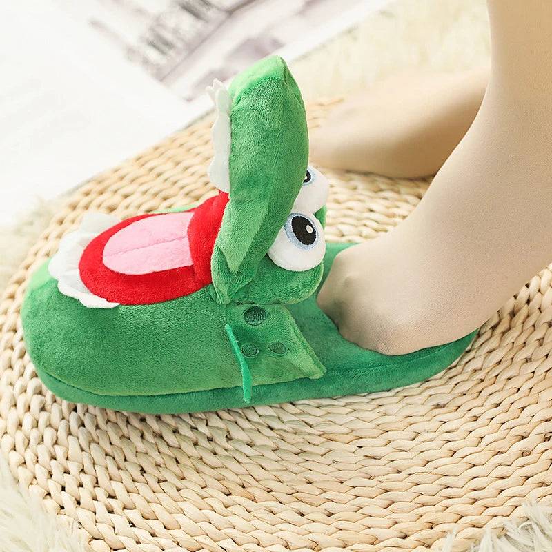 Green cartoonish aligator slipper with a red mouth on a woven mat