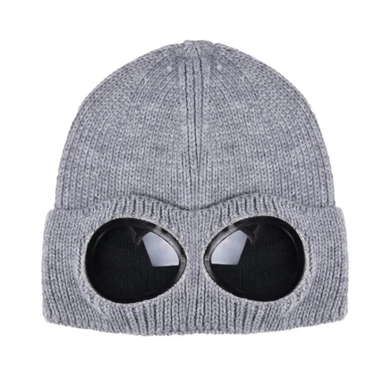 Grey knitted wool winter beanie with goggle lenses, front view