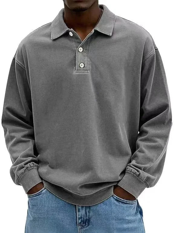 Grey men’s vintage-wash long-sleeve polo sweatshirt paired with denim