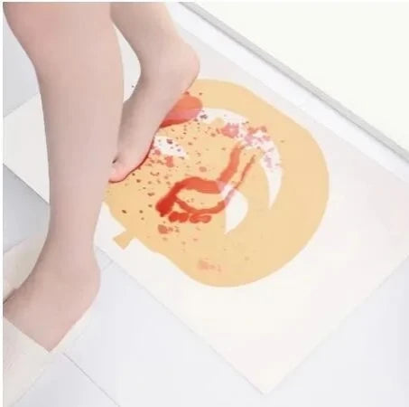 Halloween color-changing bath mat showing red footprints