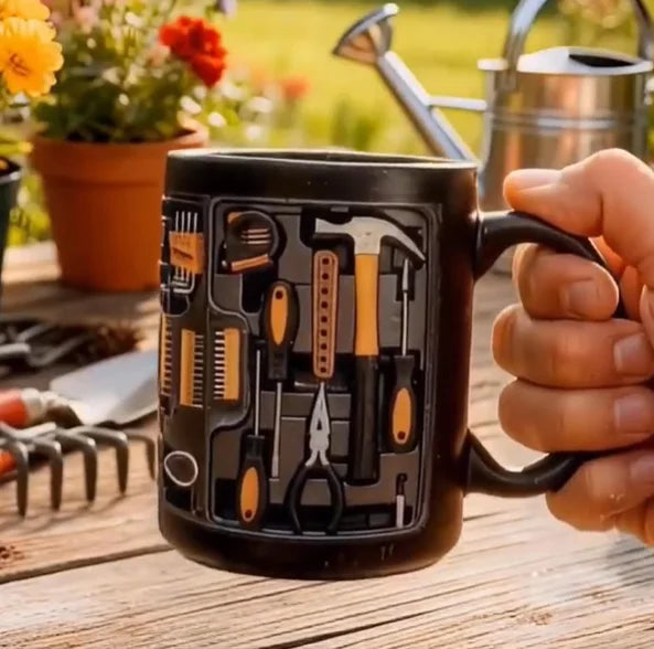 Hand holding mechanic toolbox ceramic mug outdoors - creative coffee cup gift for tool enthusiasts