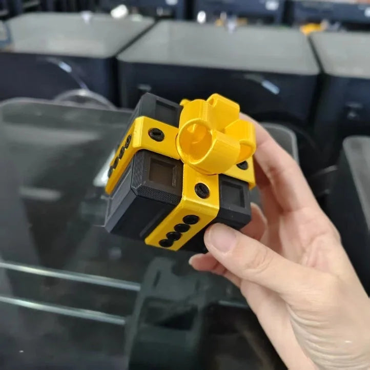 Hand holding yellow and black 3D printed gift box matryoshka - Christmas surprise decor toy