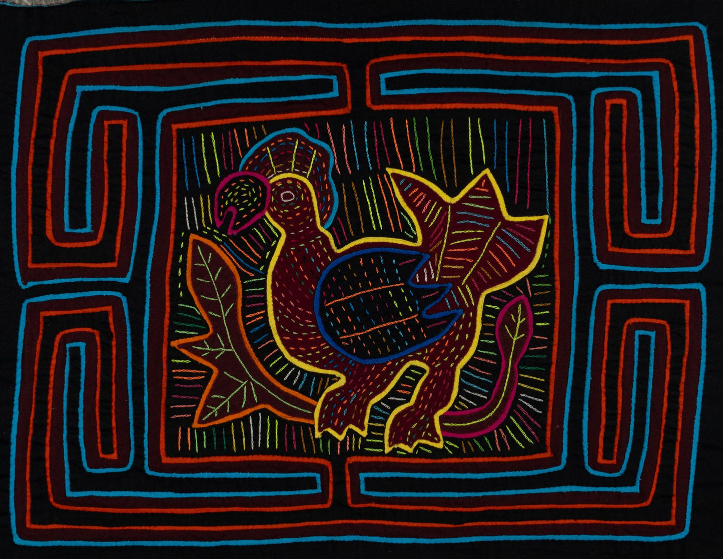 Hand-stitched Panama mola tapestry of a black orange and blue rooster, colorful folk-art fabric wall hanging