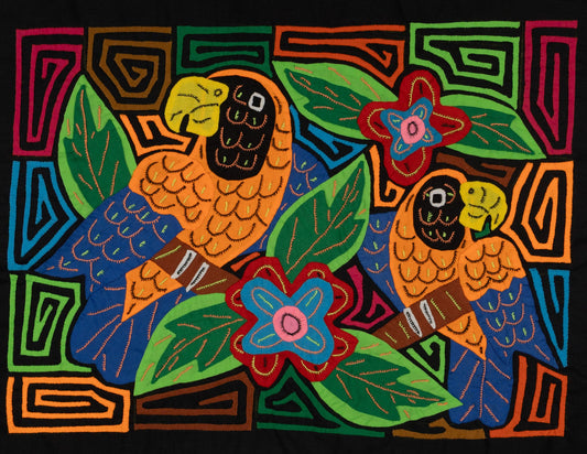 Hand-stitched Panama mola tapestry of two parrots in orange and blue, colorful folk-art fabric wall hanging
